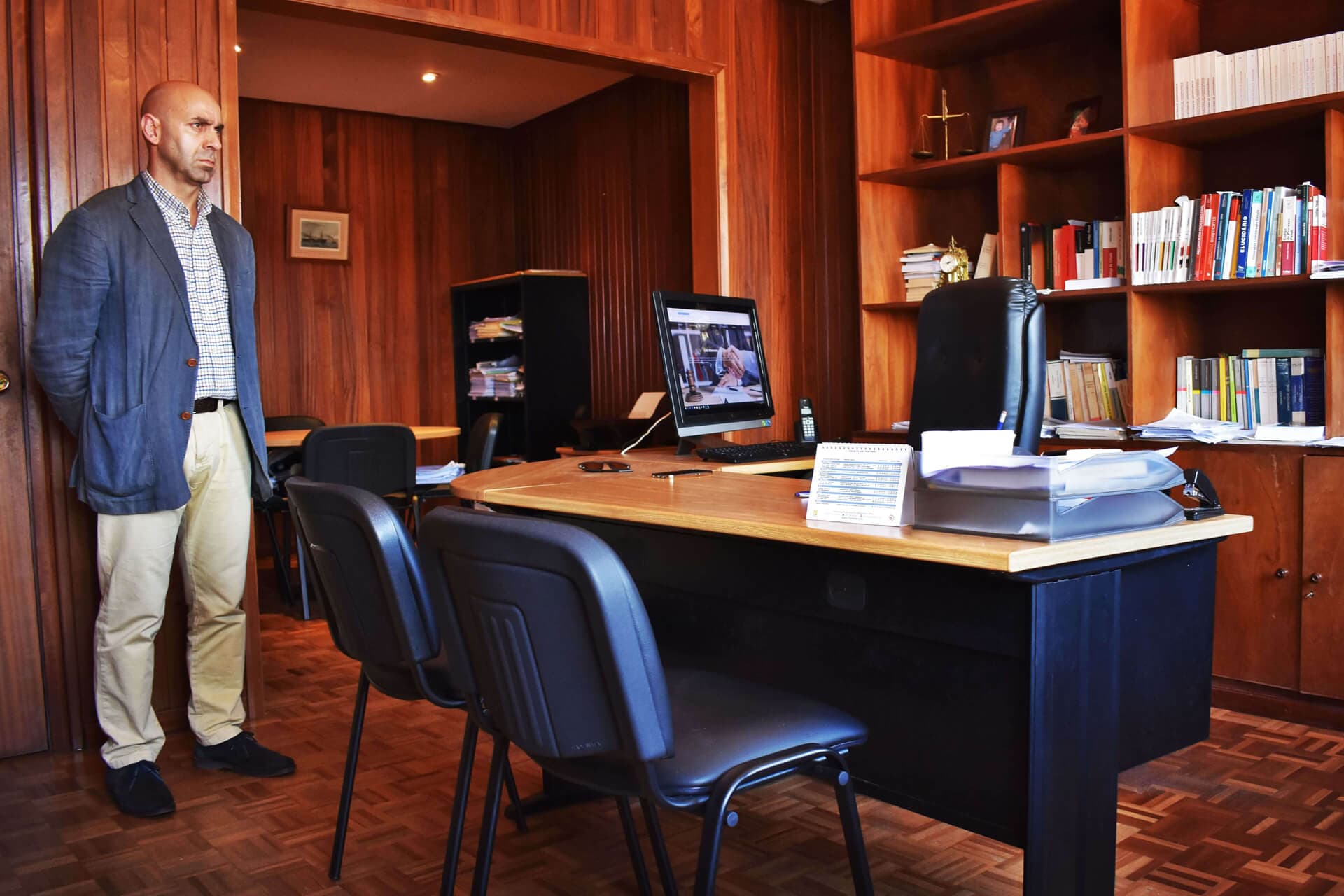 Luís Resendes at his office, next to his legal library